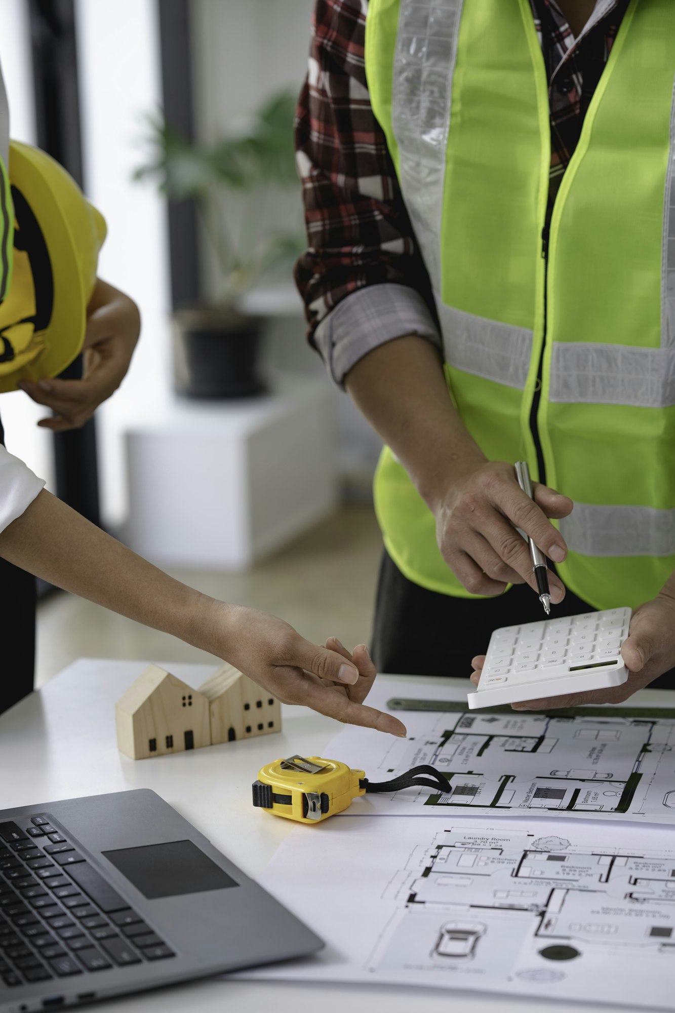 architect and engineer Hand Drawing Plan On Blue Print with architect equipment, Architects discussi